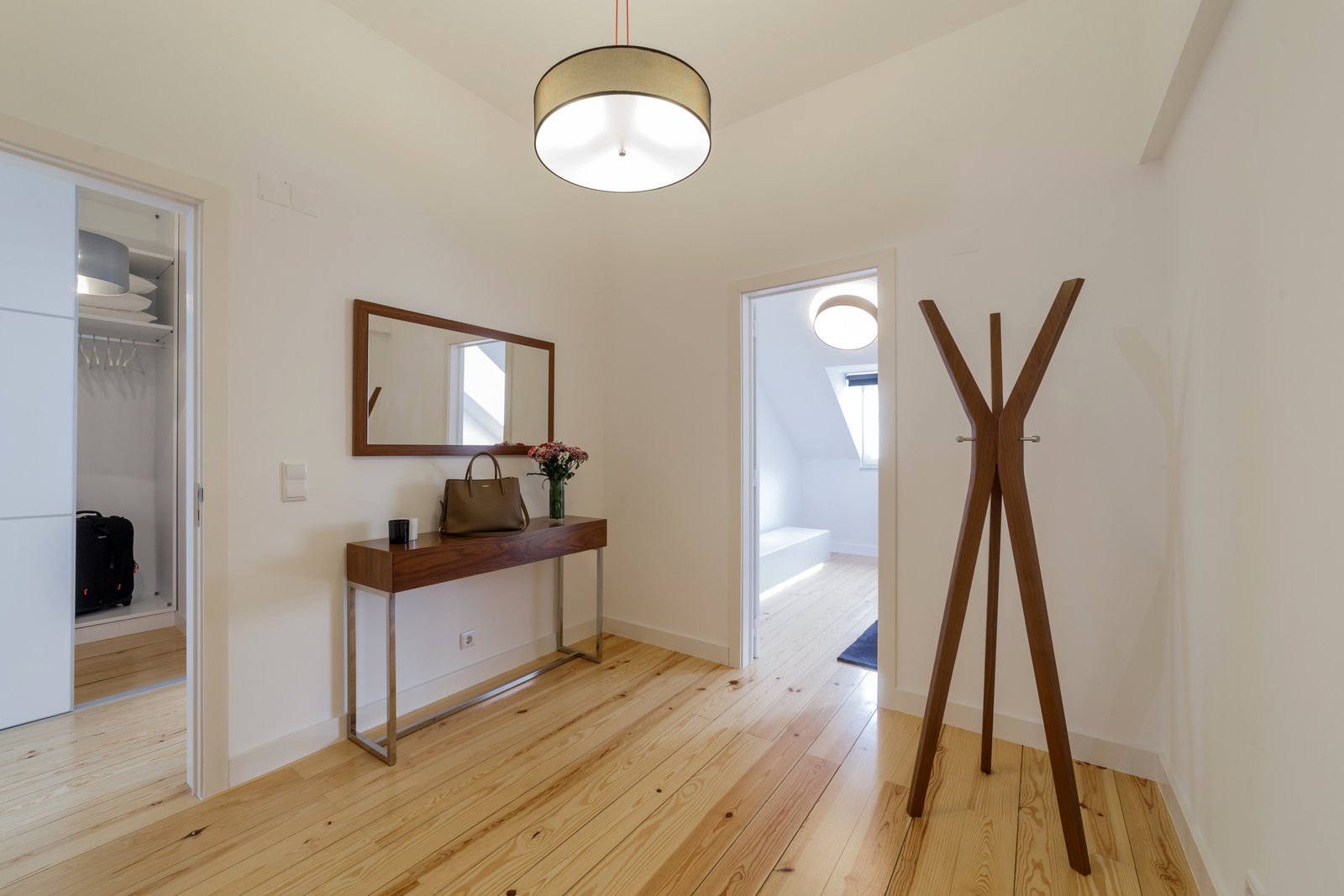 Modern apartment with white walls and light wooden floor Triplex apartment