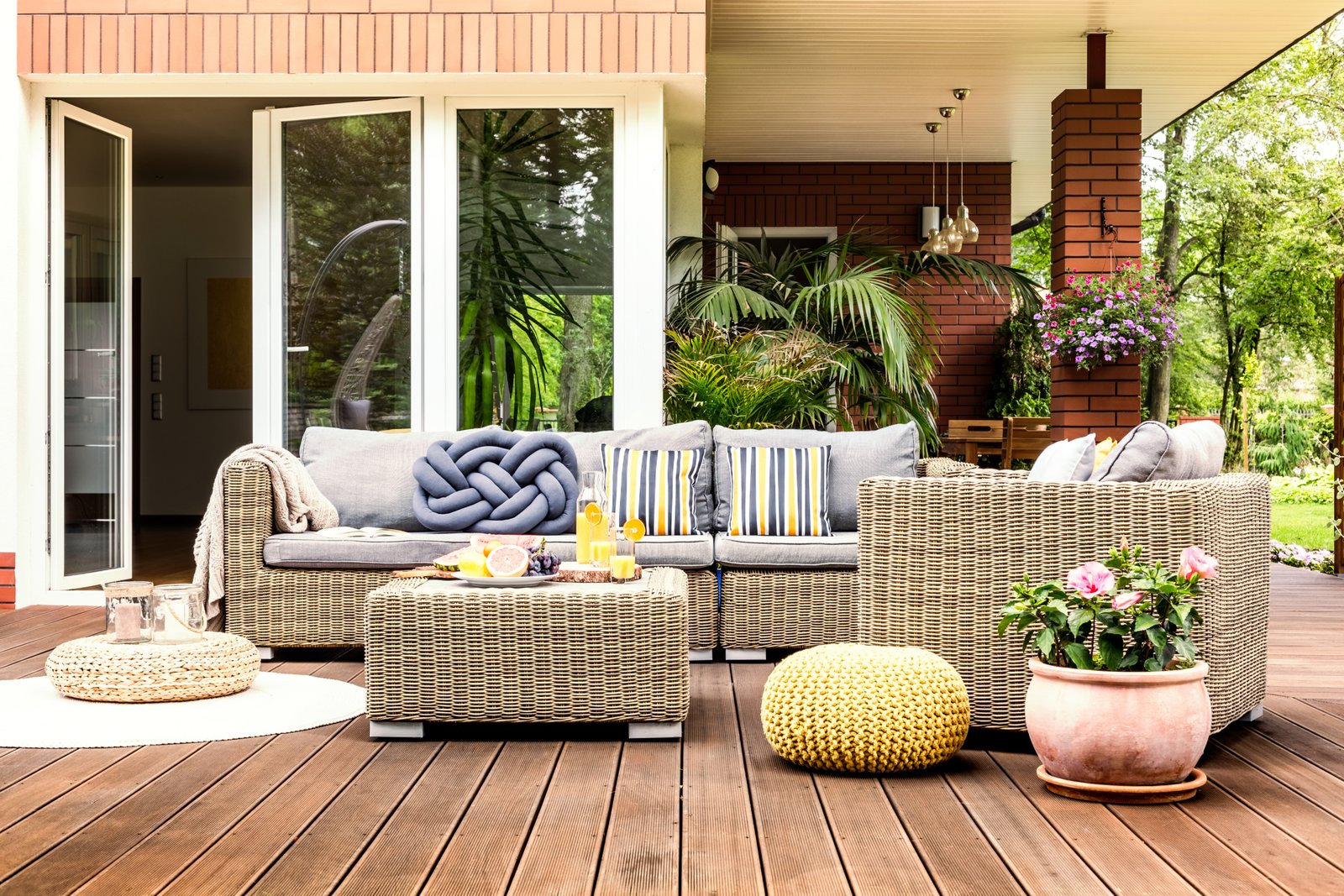 Beige garden furniture on terrace Four-bedroom villa with gym
